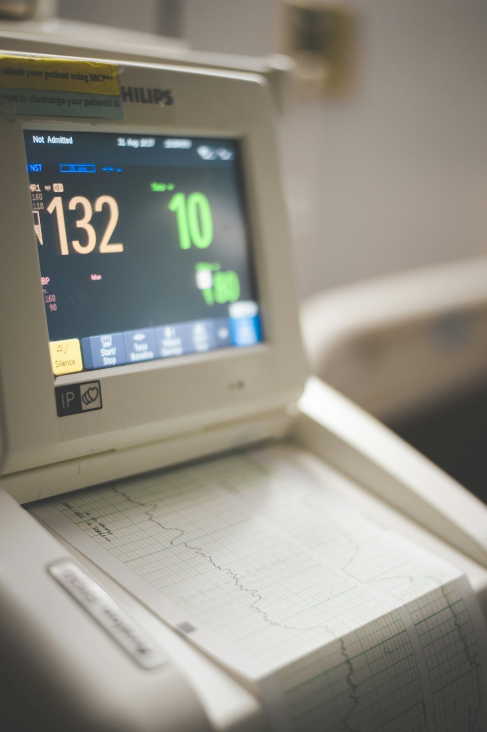 Medical monitor displaying patient vitals and waveform graph.